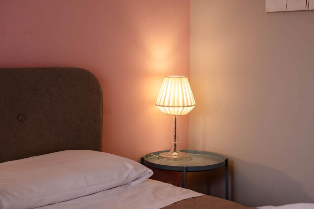 Postel nebo postele na pokoji v ubytování Casapiu Rooms