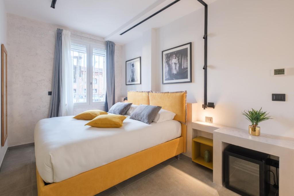 a bedroom with a bed and a fireplace at Malvasiasuites in Bologna