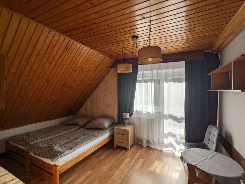 Posteľ alebo postele v izbe v ubytovaní Dom wczasowy Przy Skałkach