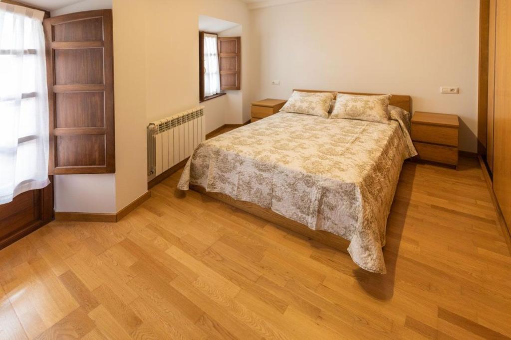 A bed or beds in a room at El Peregrino Llanes VUT