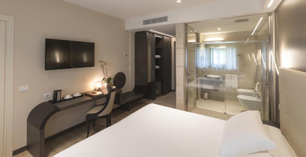 Postel nebo postele na pokoji v ubytování Smart Hotel King, by R Collection Hotels
