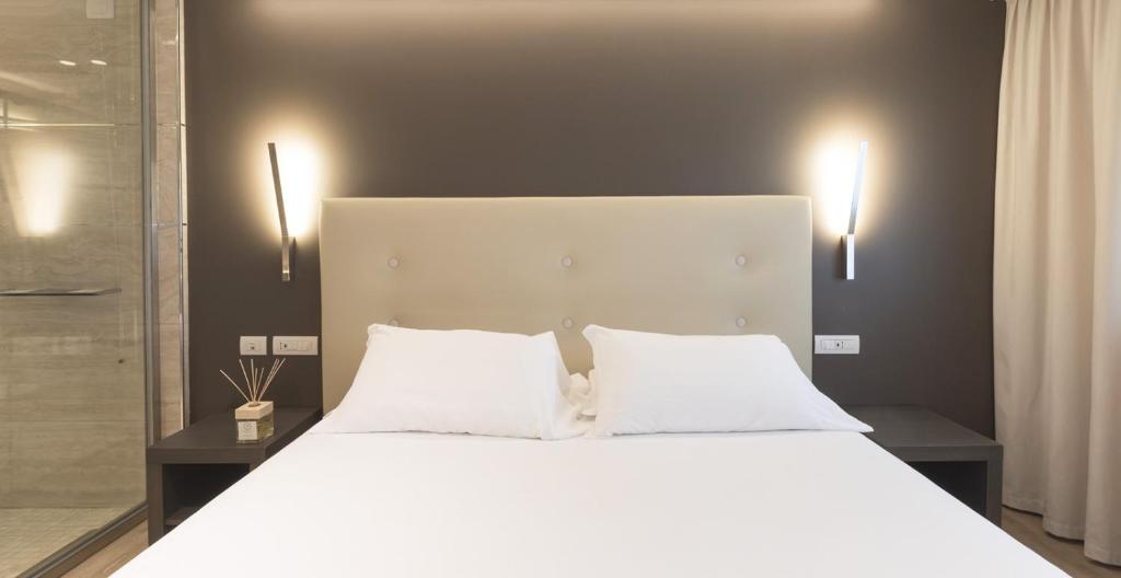 Postel nebo postele na pokoji v ubytování Smart Hotel King, by R Collection Hotels