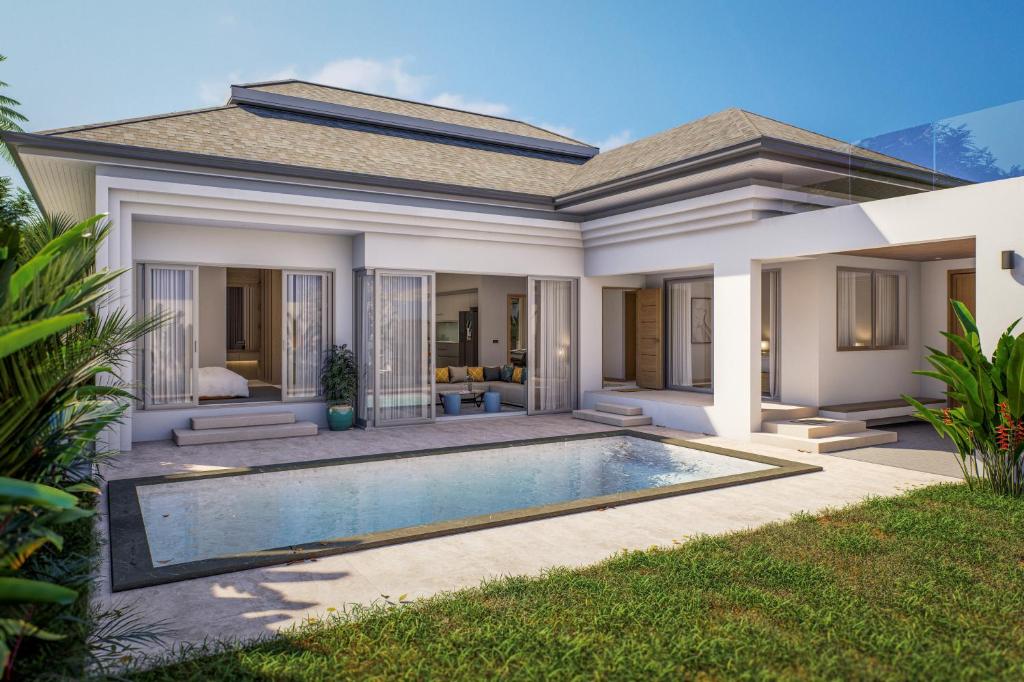 a villa with a swimming pool in front of a house at Villa Anastasia Aonang in Ao Nang 