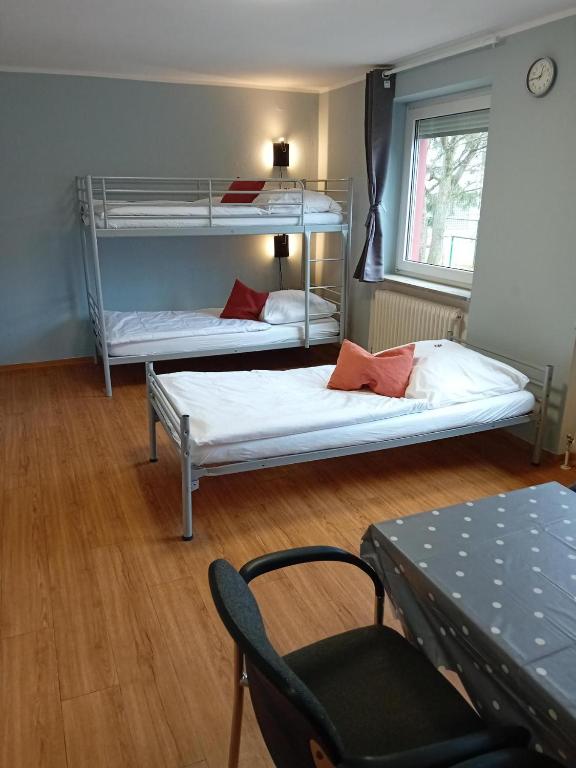 Postel nebo postele na pokoji v ubytování 1, 2, sleep Hostel Nürnberg Messe