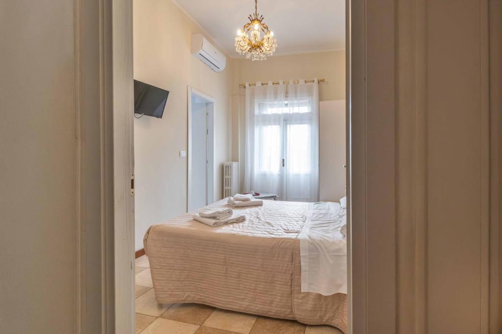 Postel nebo postele na pokoji v ubytování Al Filarmonico