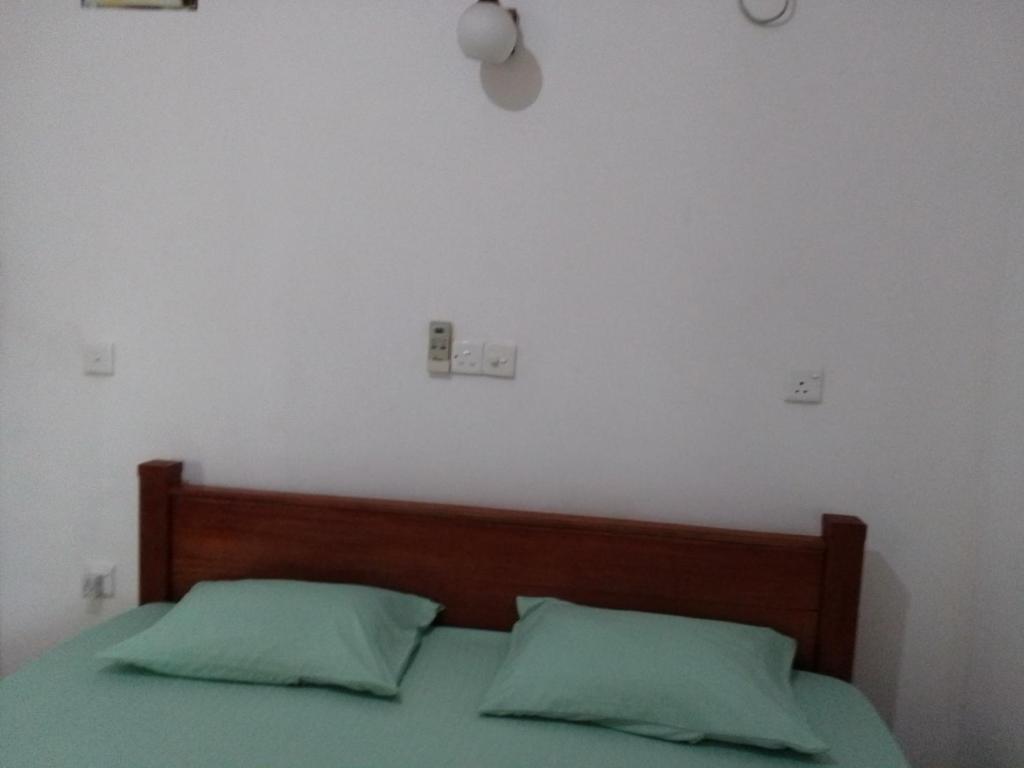 Postel nebo postele na pokoji v ubytování Pravindi Guest Home