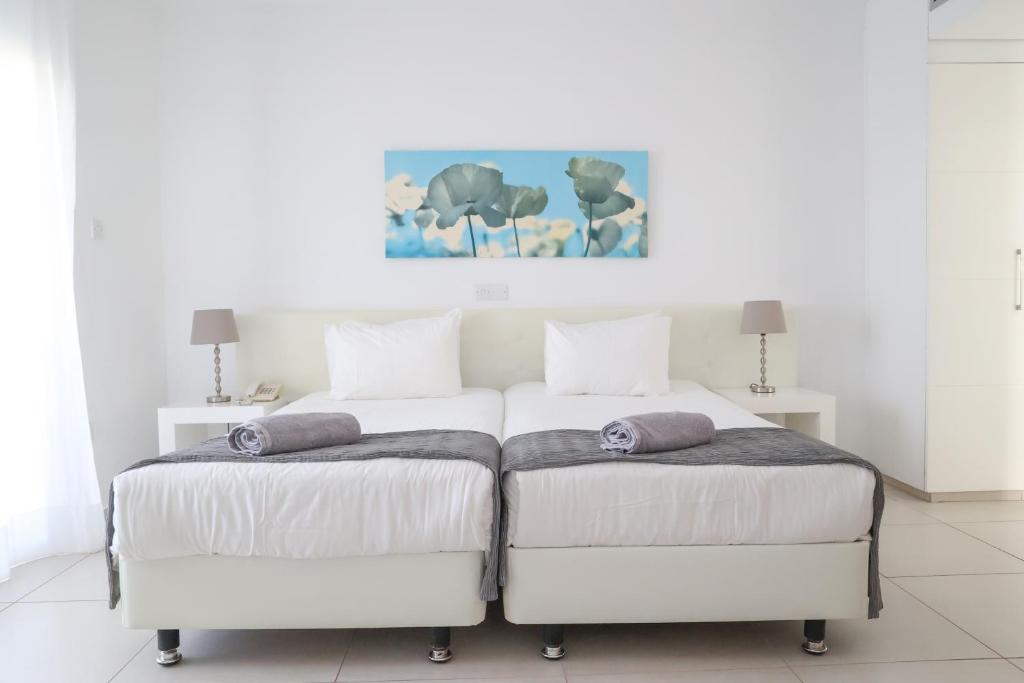 Postel nebo postele na pokoji v ubytování Alva Hotel Apartments