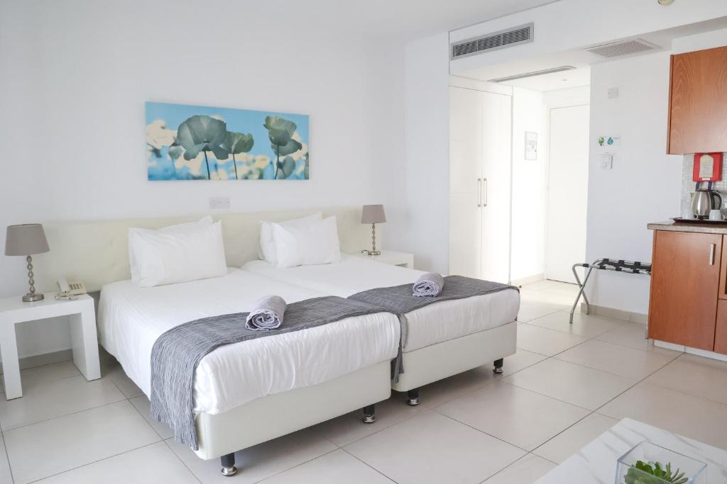 Postel nebo postele na pokoji v ubytování Alva Hotel Apartments