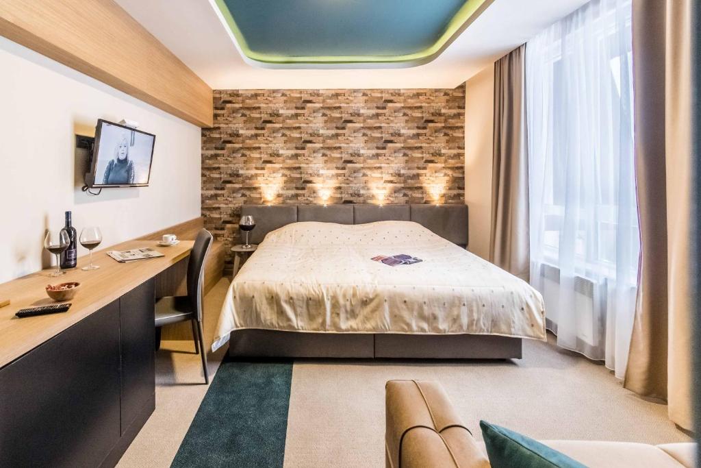 Postel nebo postele na pokoji v ubytování Hotel Kraljevi Čardaci