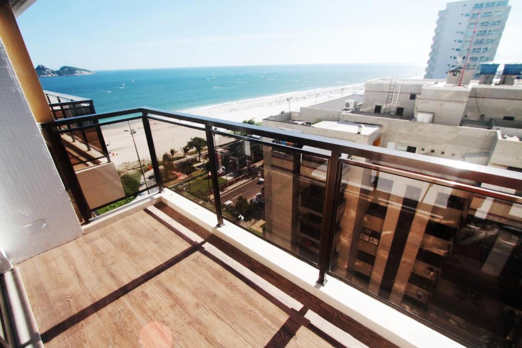 a balcony with a view of the beach and the ocean at Apartment Ocean View II in Rio de Janeiro