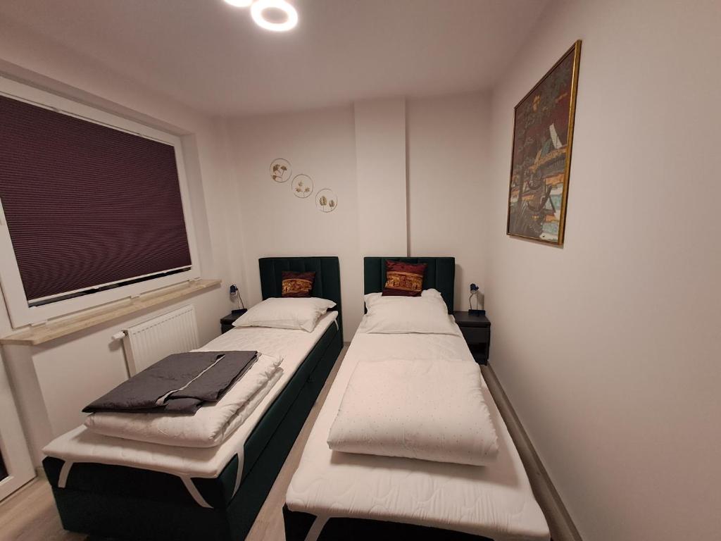 Postel nebo postele na pokoji v ubytování Warsaw Smart Apartment with Parking