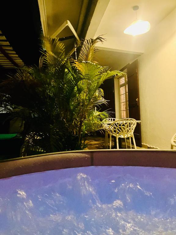 a view of a room with a table and plants at Tilys house in Capesterre-Belle-Eau