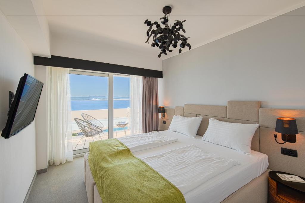 Postel nebo postele na pokoji v ubytování Hotel Omorika