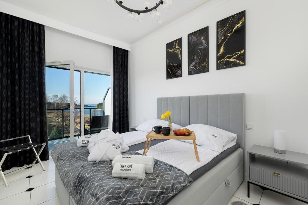 Ένα ή περισσότερα κρεβάτια σε δωμάτιο στο Luxury Apartment 22 basen i sauna D&D Apartments
