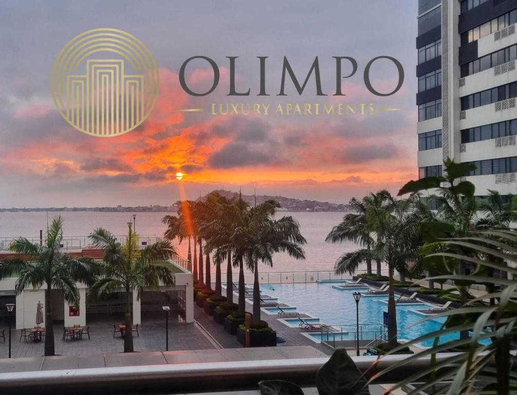 a magazine with a view of the ocean and palm trees at Departamento moderno hermosa vista al Rio y Ciudad in Guayaquil