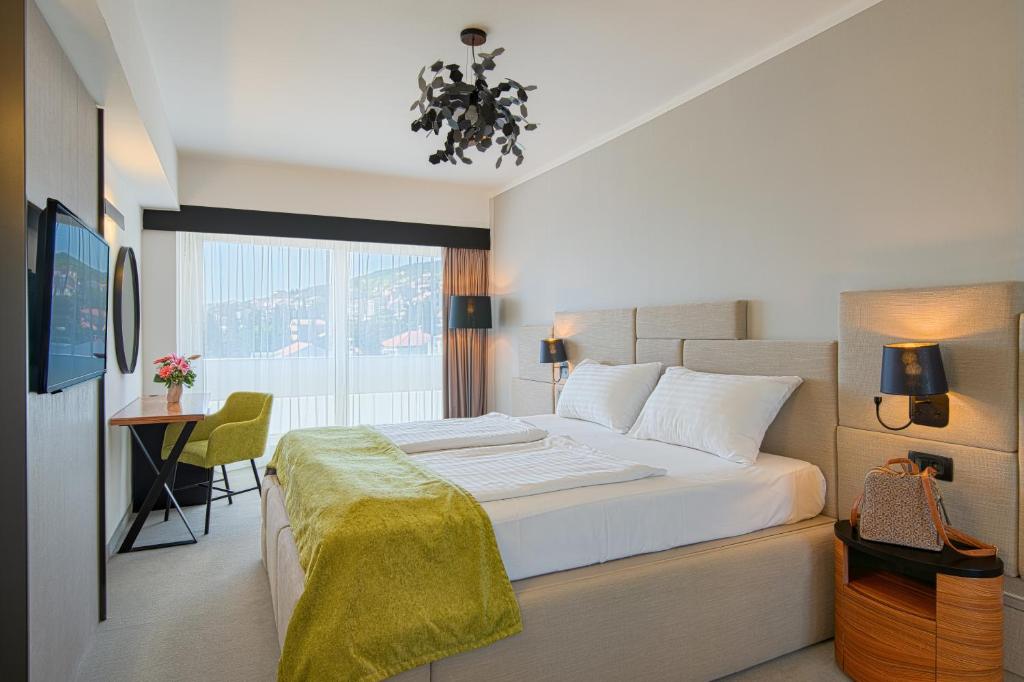 Postel nebo postele na pokoji v ubytování Hotel Omorika