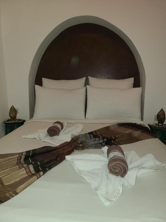 Postel nebo postele na pokoji v ubytování Riad Parfum d'Orient