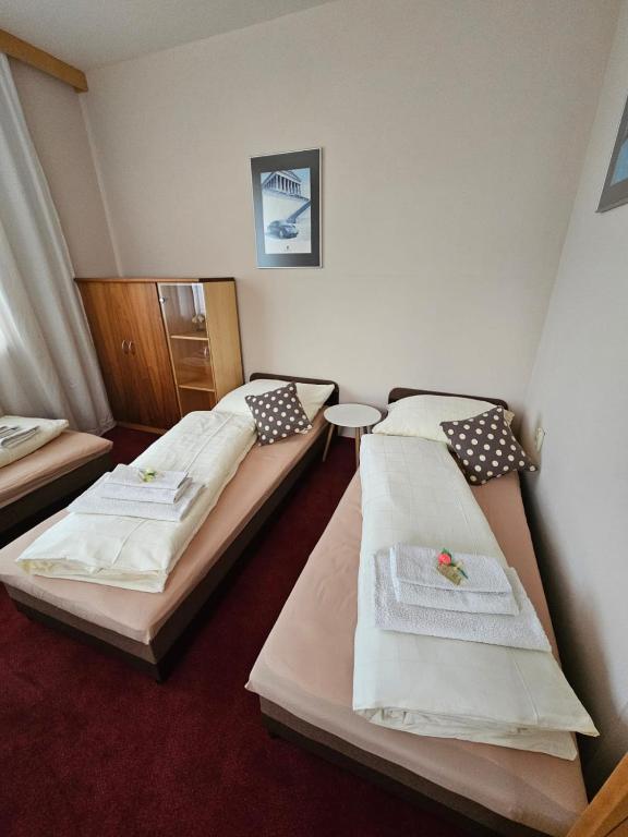 Postel nebo postele na pokoji v ubytování Penzión KOVOX