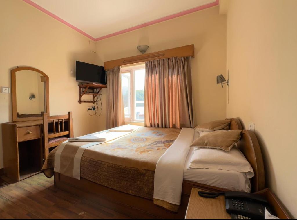 Postelja oz. postelje v sobi nastanitve Green Tara Hotel