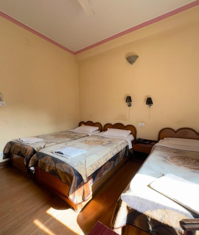 Postelja oz. postelje v sobi nastanitve Green Tara Hotel
