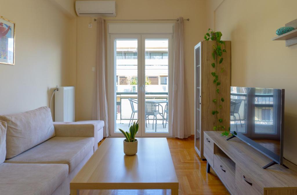 A television and/or entertainment centre at Cozy apartment in Pangrati area!