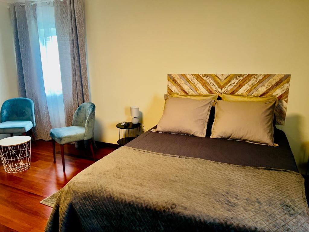 Postel nebo postele na pokoji v ubytování Quinta da Vigia