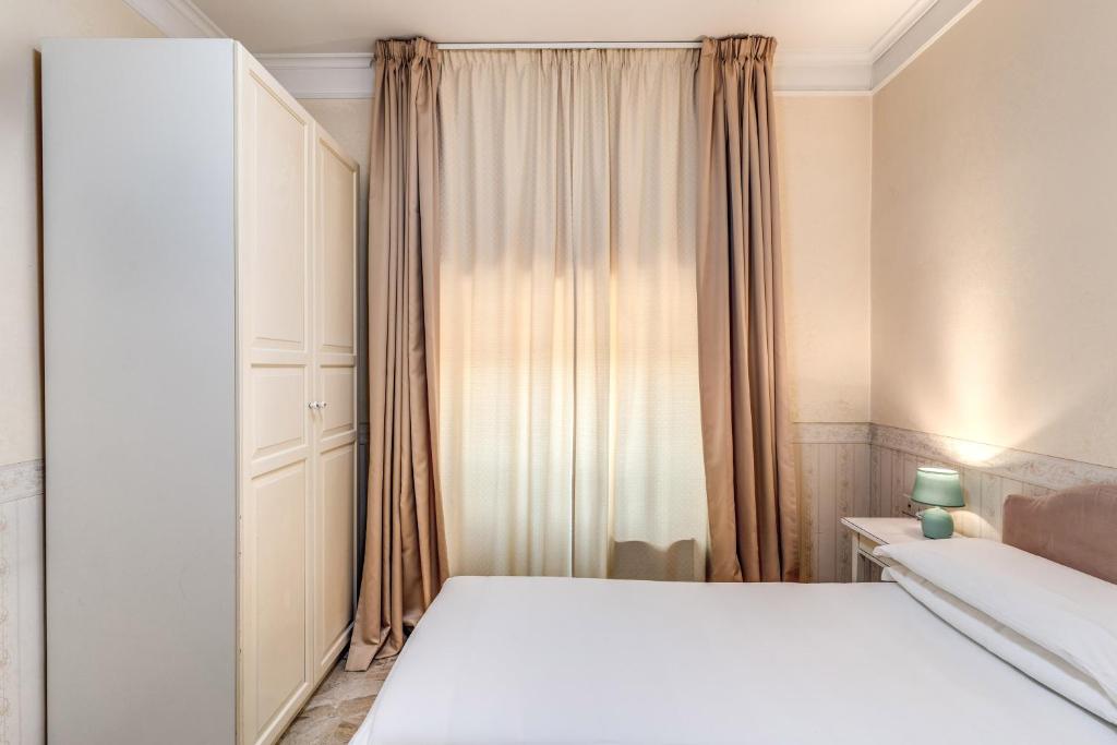 Postel nebo postele na pokoji v ubytování Hotel Orazia