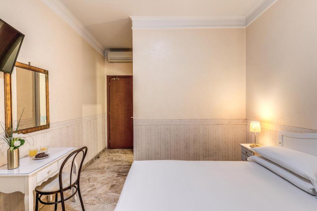 Postel nebo postele na pokoji v ubytování Hotel Orazia