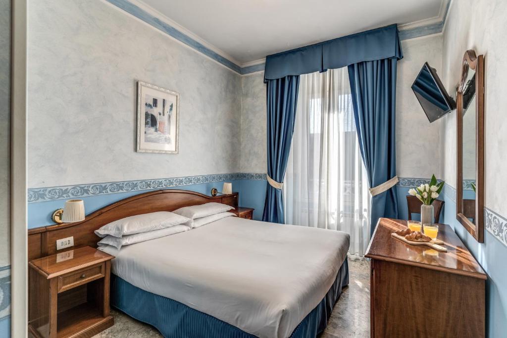 Postel nebo postele na pokoji v ubytování Hotel Orazia