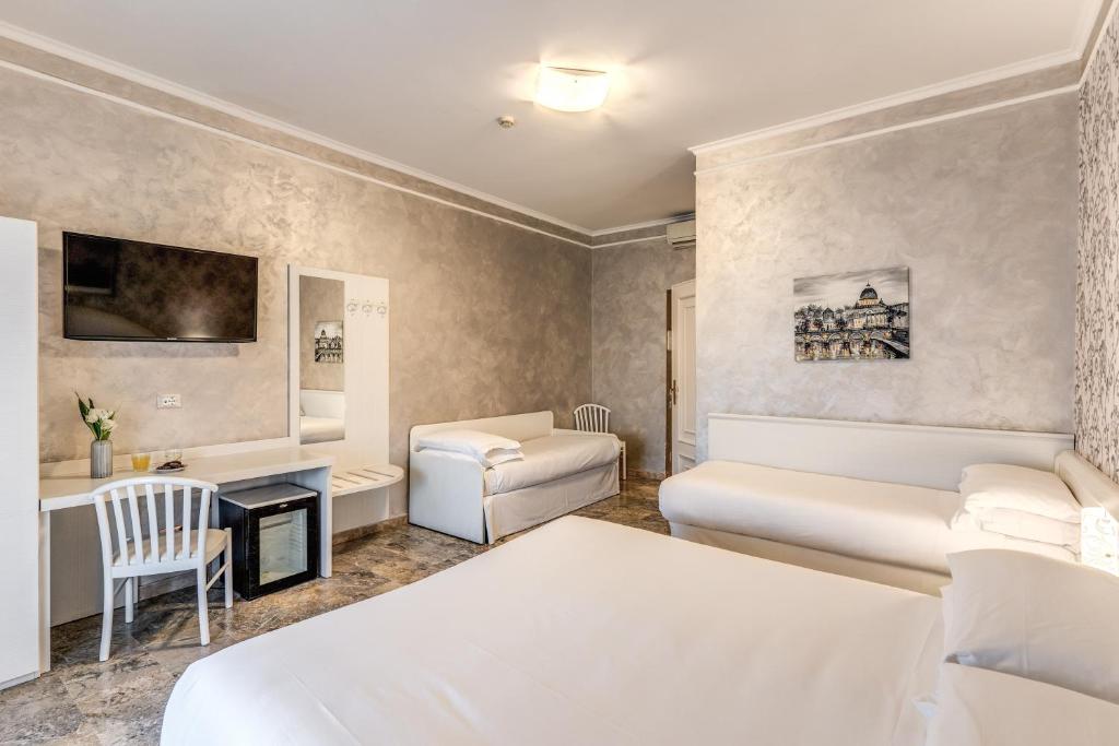 Postel nebo postele na pokoji v ubytování Hotel Orazia