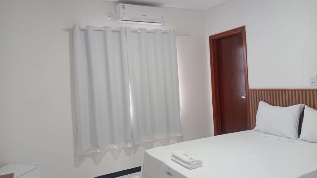 Postel nebo postele na pokoji v ubytování Hotel Itaberaba