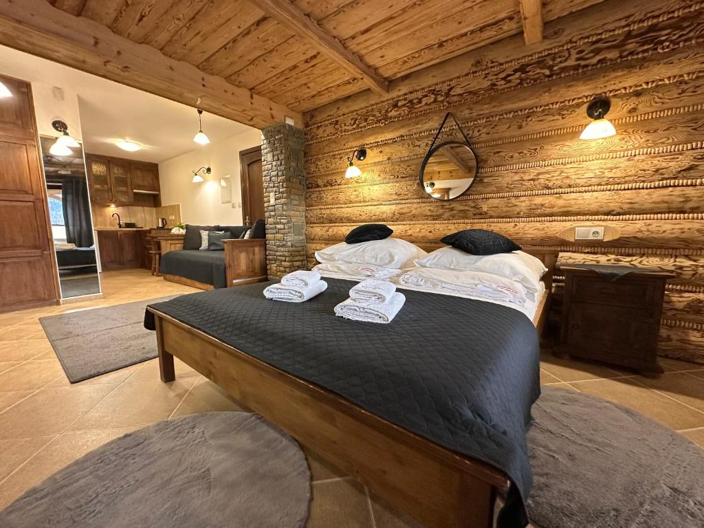 Posteľ alebo postele v izbe v ubytovaní Apartamenty z widokiem na Tatry Cztery Pory Roku