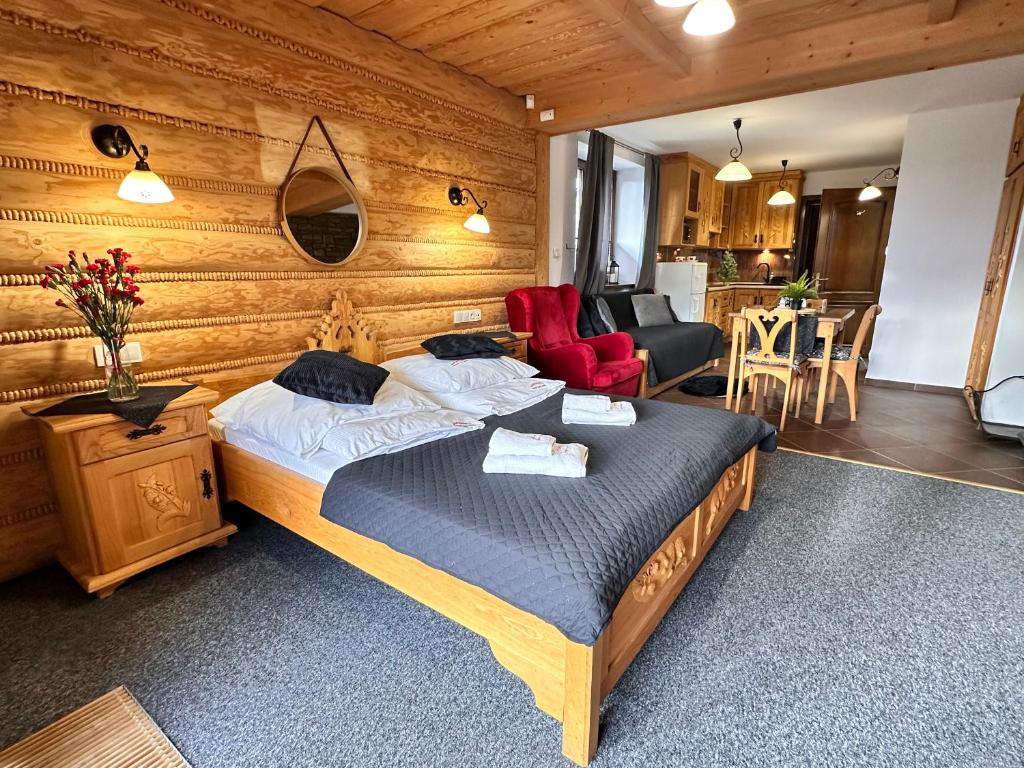 Posteľ alebo postele v izbe v ubytovaní Apartamenty z widokiem na Tatry Cztery Pory Roku