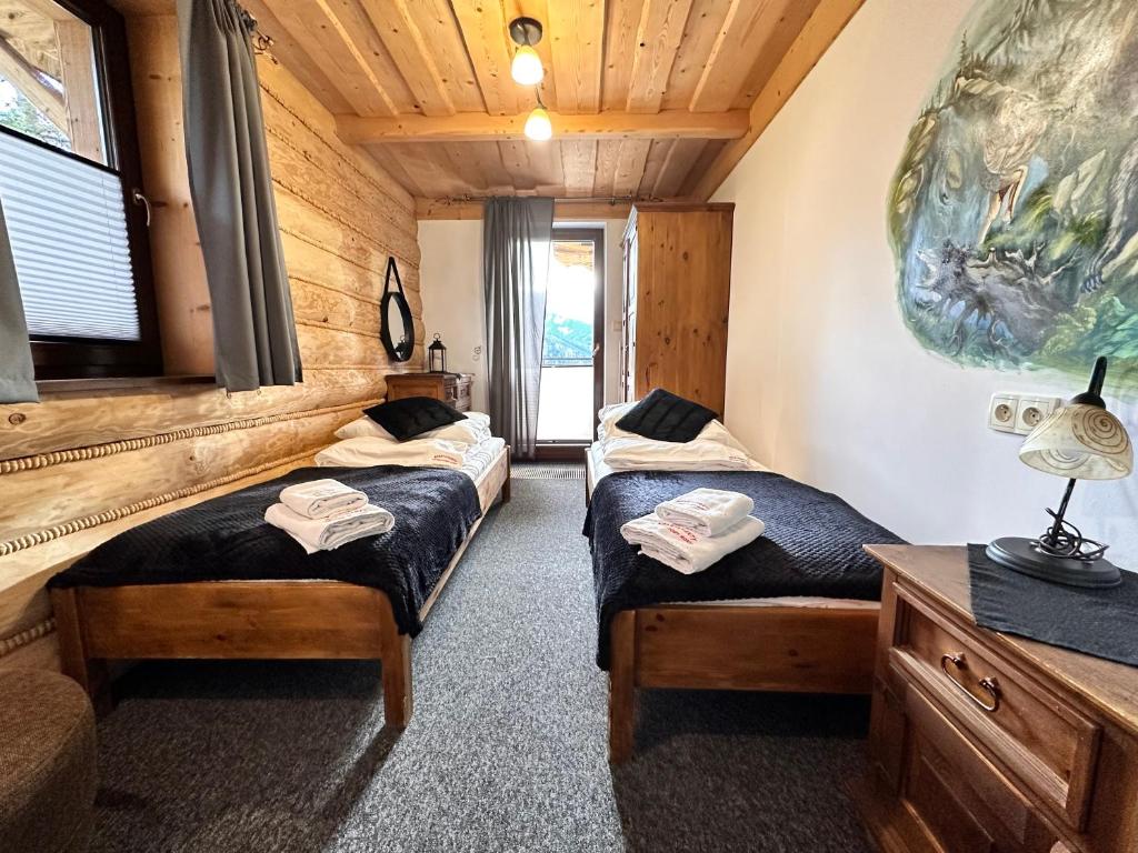 Posteľ alebo postele v izbe v ubytovaní Apartamenty z widokiem na Tatry Cztery Pory Roku