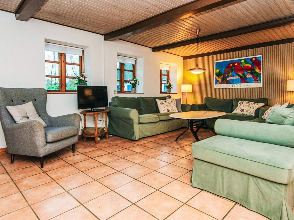 Posezení v ubytování 14 person holiday home in Ørsted-By Traum