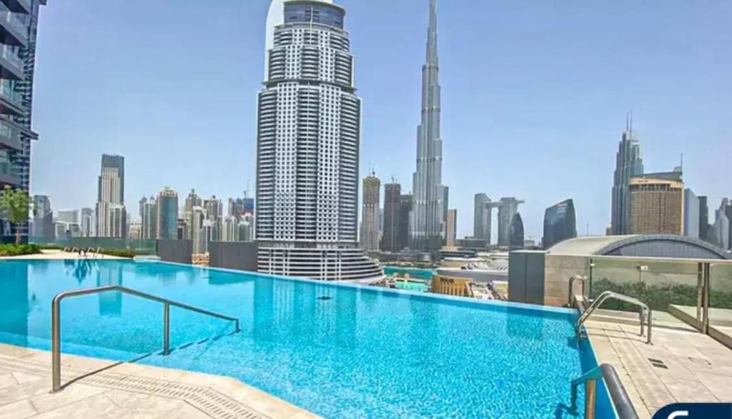 a large swimming pool on top of a building at " Luxury Stay in Downtown Dubai - Stunning Views & Prime location ! in Dubai
