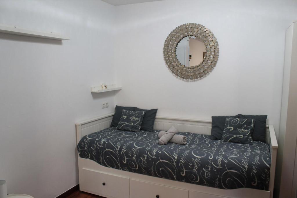 A bed or beds in a room at BURGOS CONTEMPLA Centro histórico. Frente al arco