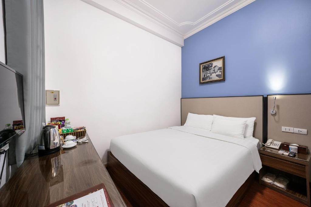Postel nebo postele na pokoji v ubytování A25 Hotel - 53 Tuệ Tĩnh