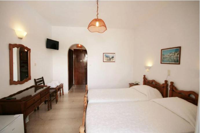 Postel nebo postele na pokoji v ubytování Atlantis Hotel