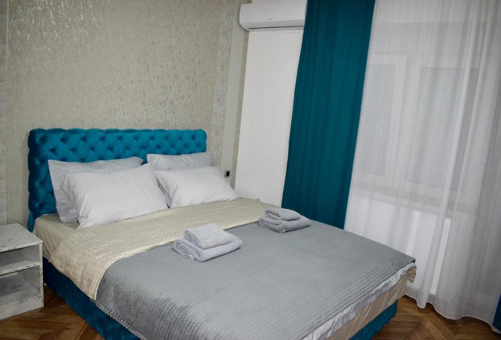 Postel nebo postele na pokoji v ubytování Pink Apartmani