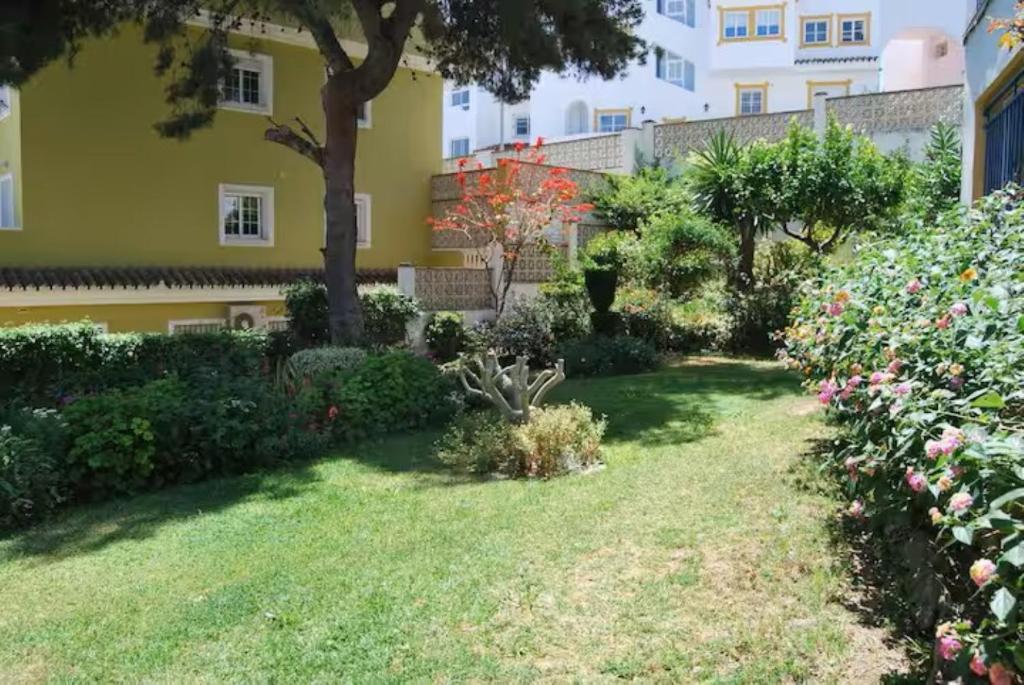 A garden outside Shiny Studio with Pool & Carihuela Beach at 500m