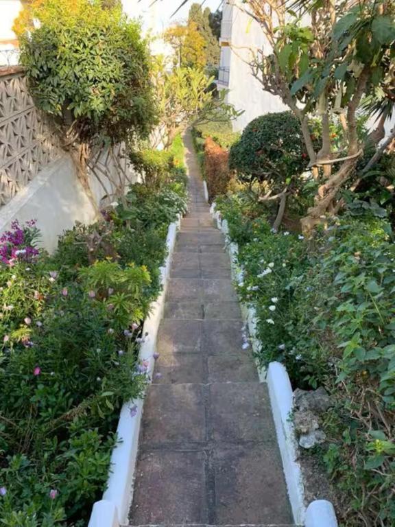 A garden outside Shiny Studio with Pool & Carihuela Beach at 500m