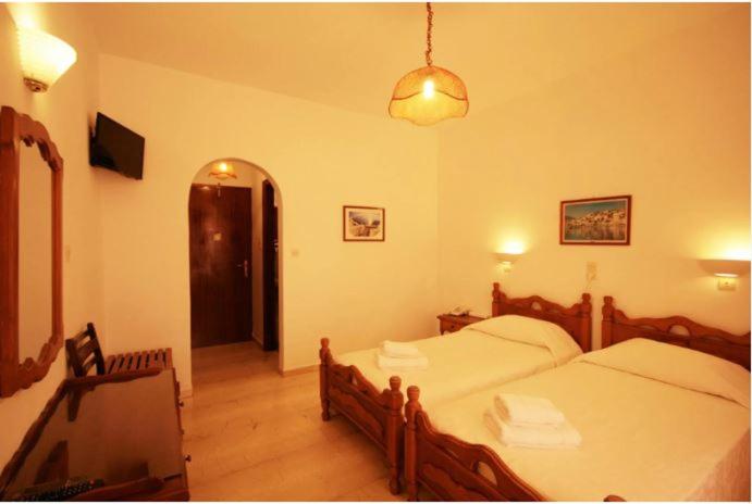 Postel nebo postele na pokoji v ubytování Atlantis Hotel