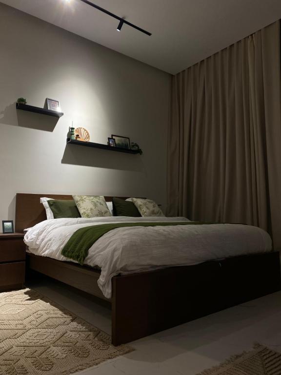 a bedroom with a large bed in a room at استوديو بمدخل خاص حي النرجس in Riyadh