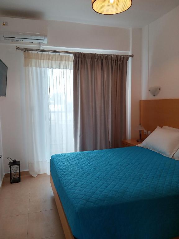Postel nebo postele na pokoji v ubytování Corafili Holiday Suites