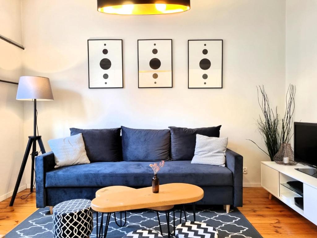 Televízia a/alebo spoločenská miestnosť v ubytovaní Apartament Dwa Lwy Gdańsk Stare Miasto
