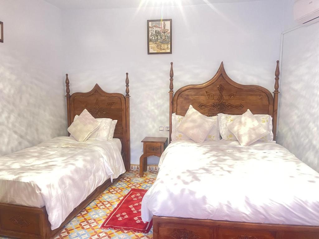 Una cama o camas en una habitación de dar solaiman