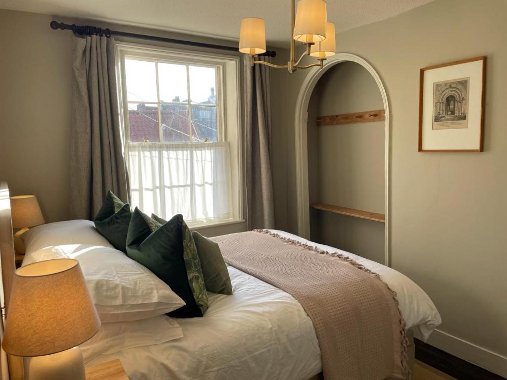 Ένα ή περισσότερα κρεβάτια σε δωμάτιο στο Seascape Cottage