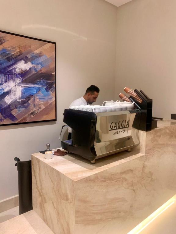a man is getting a bed in a salon at فندق ليورا Liora Hotel in Riyadh
