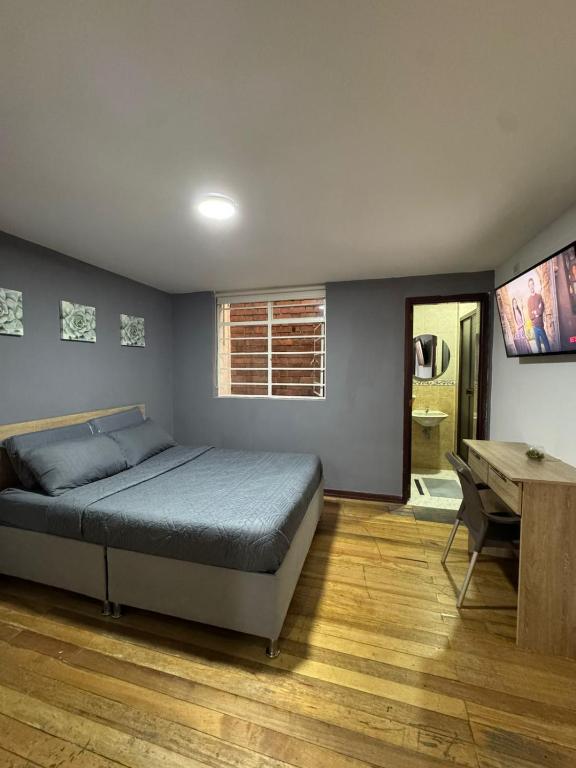Postel nebo postele na pokoji v ubytování Hostelfc San Luis